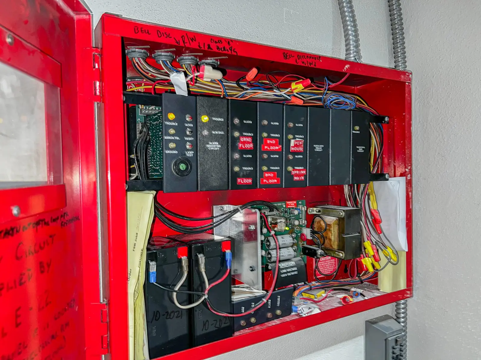 Fire alarm control panel open for service