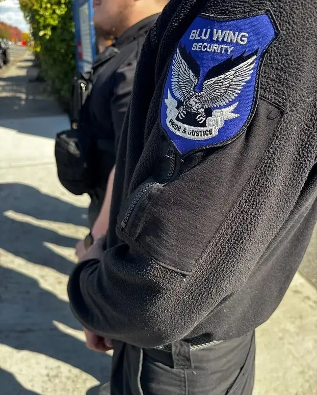 Blu Wing Security shoulder patch on a guard's uniform